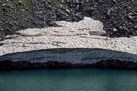 Remains of snow in Lake Sassolo, Lago di Sassolo, Sambuco Valley, Vale Sambuco, near Fusio,