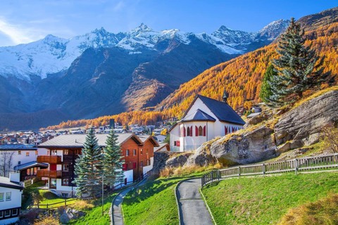 View of the village with Dom 4545m and Täschhorn 4491m of the Mischabel group in autumn, Saas-Fee,