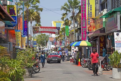 Colourful signboards in shopping street in Little India, ethnic Indian enclave in the city George