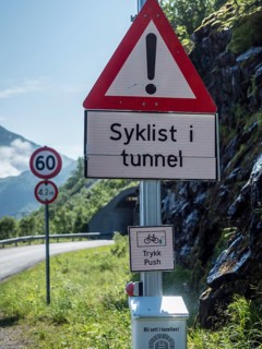 Warning system to show if cyclists are cycling in the next unlit tunnel, if button is pressed light