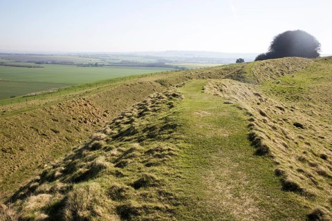 Defensive ditch and rampart at Barbury Castle Country Park, Iron Age hill fort, Wiltshire, England,