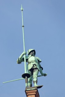 Sculpture knight with helmet, lance on roof, statue, figure, bronze, spear, armour, roof, spear,