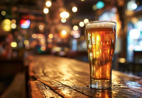 Cup of beer standing on the table ready to be consumed before the sport game, AI generated
