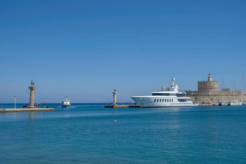 Elafos and Elafina, stag and hind, sculptures on columns, harbour entrance Mandraki harbour,