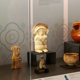 Figurine model of woman in embroidered outfit, from Jaina, Late classical period, Mayan