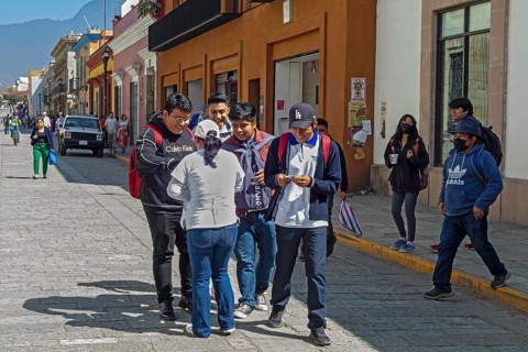 Oaxaca, Mexico, A health worker hands out free condoms as part of a fight against