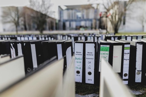 File folders stand in front of the Federal Chancellery as part of a protest action by the German