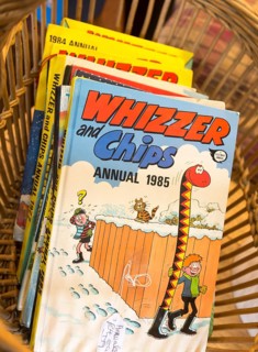 1980s children's cartoon comic book annuals Whizzer and Chips 1985, inside antiques centre,