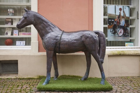 Metallic, grey horse sculpture in the city of horses Warendorf, district of Warendorf, North