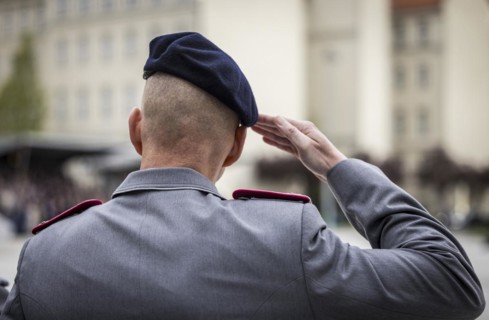 A soldier salutes during the final roll call at the Federal Ministry of Defence to mark the