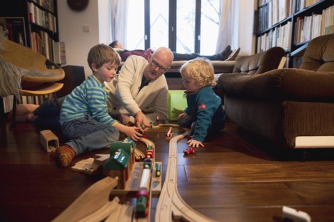 Playing children, two and four years old and their grandfather, in the family, Bonn, 24.12.2023. In