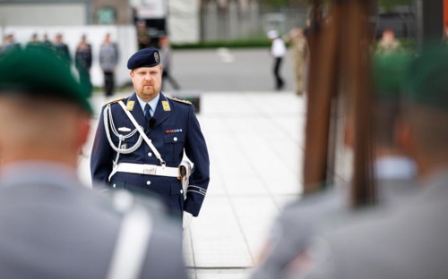 An air force soldier of the guard battalion gives commands to army soldiers of an honour formation