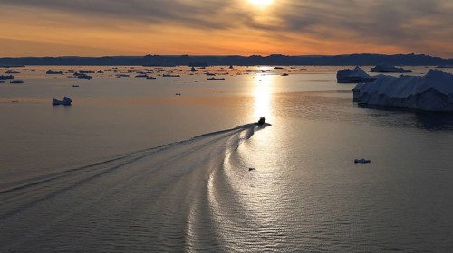 Iceberg seen from cruise ship vacation near Greenland coast in Arctic circle near Ilulissat Disko