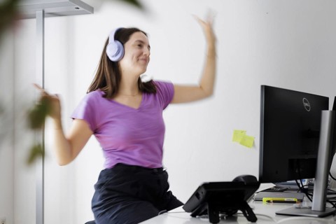 A woman dances at her workplace in Berlin, 08/08/2024
