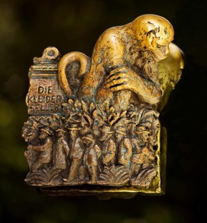 Door handle on the glass door of the town hall with motifs from the history of the city of