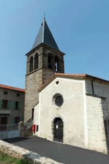 Saint-Roch Church under a clear blue sky in Aubazat village, Haute-Loire, Auvergne-Rhone-Alpes,