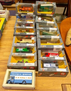 Boxes of Corgi model trucks, vans and other vehicles on display at auction, UK