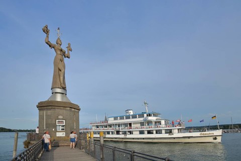 Sculpture Imperia by Peter Lenk 1993, entrance, passenger ship, shipping traffic, people, jetty,