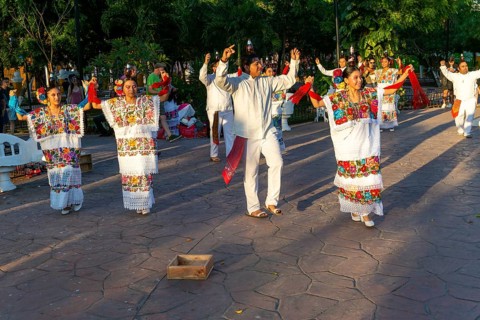 Folk dancers with bottles balanced on their heads, Francisco Cantón Rosado Park, Valladolid,