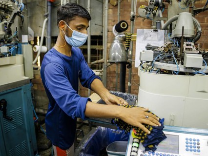 Employees of Inter Market Knit Private Limited producing socks. Lahore, 22.08.2024. Photographed on
