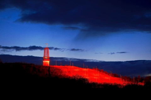 Artwork Illuminated at night with red illuminated slagheap Rheinpreussen by Otto Piene, Moers, Ruhr