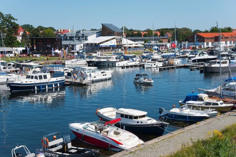 A lively marina with many boats and surrounding houses, Gizycko, Warminsko-Mazurskie,