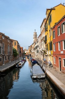Motorboats and colourful house facades on a small canal, Venice, Veneto, Italy, Europe