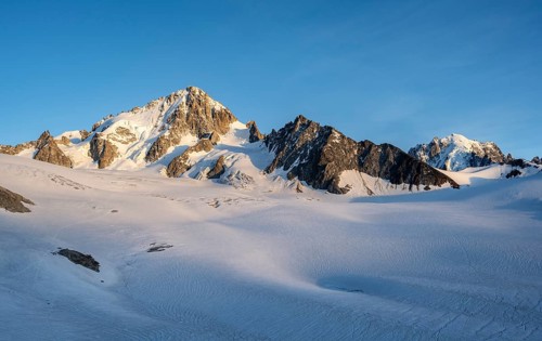 High alpine mountain landscape at sunset, summit of Aiguille de Chardonnet and Aiguille Verte,