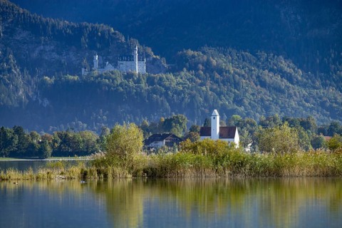 Forggensee near Füssen, behind it Waltenhofen and Neuschwanstein Castle, Ostallgäu, Allgäu, Swabia,