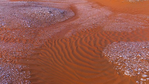 Gravel surrounded by wind-blown sand structures, Huqf stone desert, Arabian Peninsula, Sultanate of