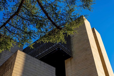 Modern Design Building Against Blue Clear Sky and Tree Branch in Campione d'Italia, Lombardy,