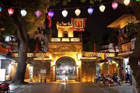 Illuminated old city gate at night, Hanoi, Vietnam, Asia