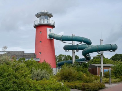 Lighthouse slide, Ocean wave adventure pool, Norddeich, East Frisia, Lower Saxony, Germany, Europe