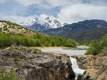 View over river Rio Tranquilo to mountain range of San Lorenzo, on road X-901 leading to Calluqueo