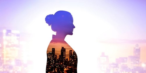 AI generated profile of a businesswoman with a double exposure of city lights, representing