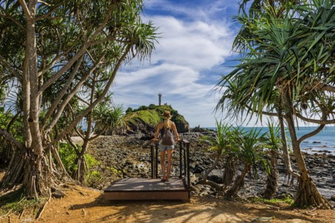 Tourist in Mu Ko Lanta National Park with view to the lighthouse in the south of the island,