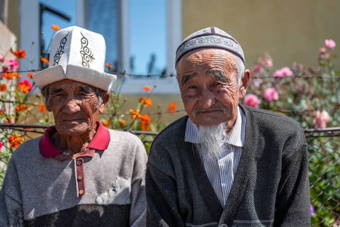 Portrait, two local elderly men with traditional hats, Issyk-Kul region, Kyrgyzstan, Asia