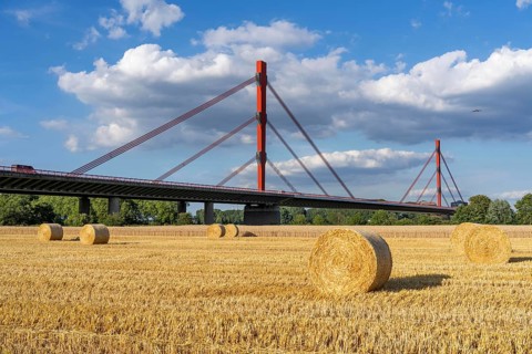 Grain field, harvested, straw bales, near Duisburg-Baerl, behind the motorway bridge of the A42