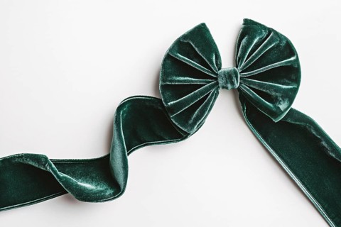 Beautiful green velvet ribbon on white background. Generative AI, AI generated