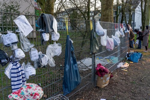 Gift fence with donations for the homeless and needy, food, hygiene articles, clothing, in Essen