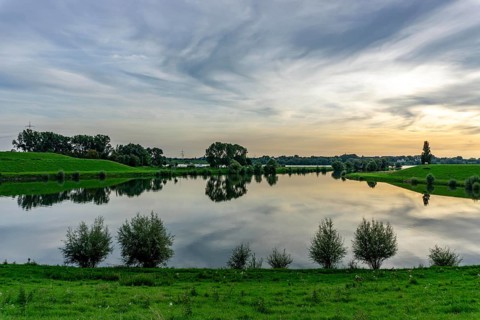 Lower Rhine landscape, reflection in the turning basin of the northern harbour of Walsum, view to
