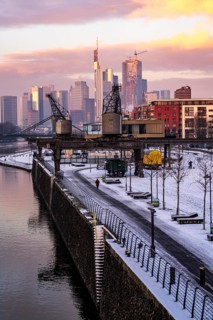 The skyline of Frankfurt am Main, skyscrapers of the banking district, historic harbour cranes at