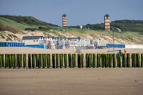 Beach huts, North Sea coast in Zeeland, called Zeeland Riviera, breakwater, made of wooden piles,