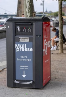 Waste compactor, waste bin in public spaces, here on the banks of the old town in Düsseldorf, the