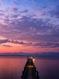 Footbridge on Lake Chiemsee at dawn, with the Chiemgau Alps behind, Chiemgau, Upper Bavaria,