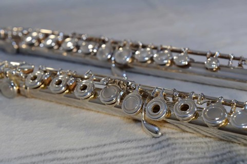 Close-up of the keys of a silver flute