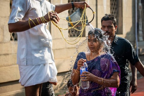 Pilgrims at a washing ritual with 22 stations around the Ramanathaswami temple, a ceremony in which