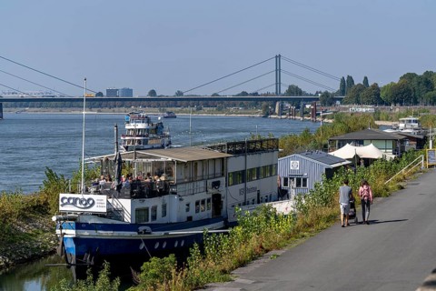 Restaurantschife at the Rhine harbour on Robert-Lehr-Ufer, in Düsseldorf, in the background the