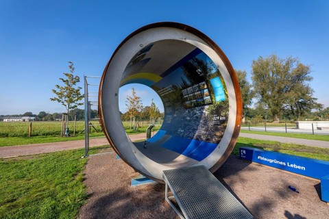 Original sewer pipe element of the Emscher sewer as an information stand in Emscherland, a new