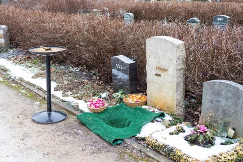 Prepared grave site for an urn burial with sand and flower baskets, urn grave, Riesa cemetery,